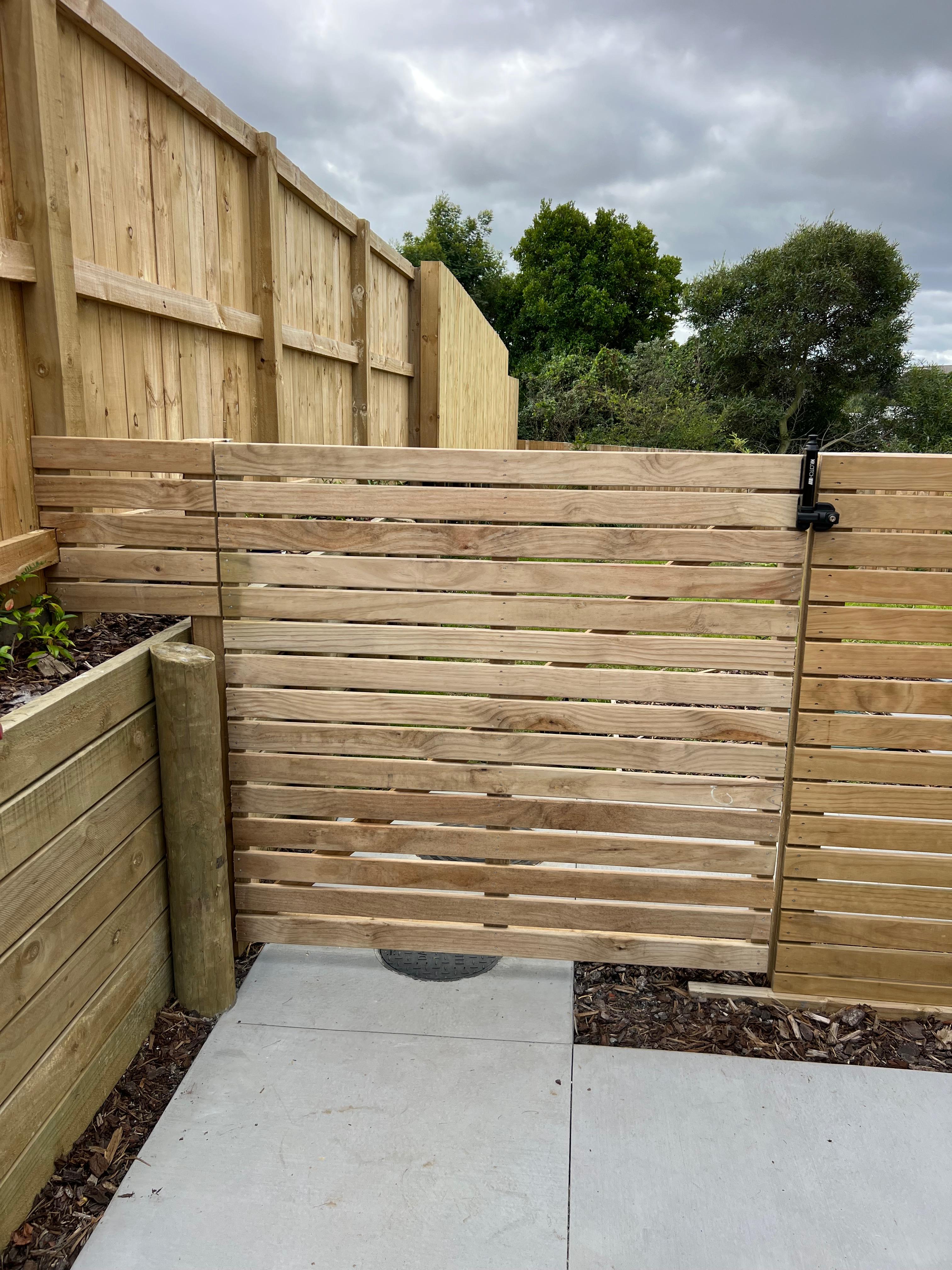 Custom wooden gate installation in Auckland